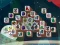 Spill Among Mahjong Tiles online